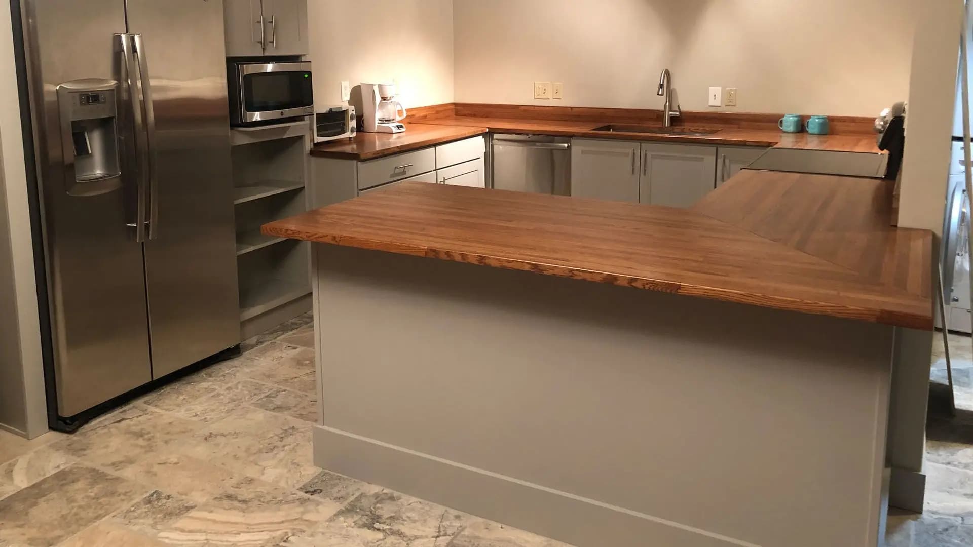 a kitchen with a wood counter top