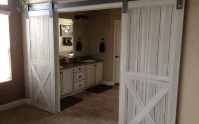 a bathroom with a barn door