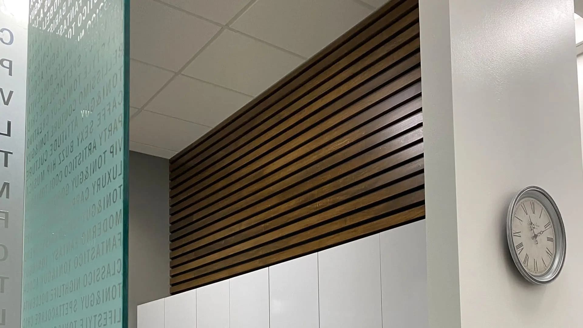 a white cabinets with wood slats