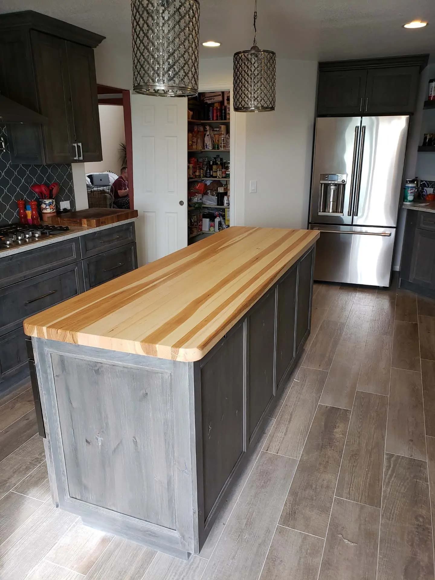 a kitchen with a wooden island