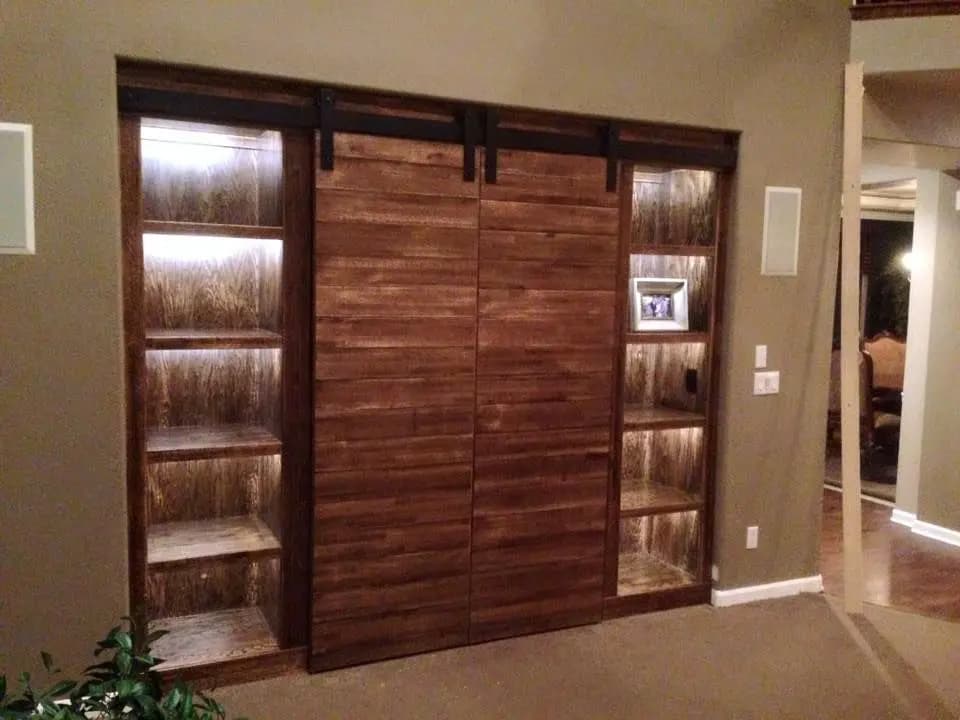 a sliding barn door with shelves