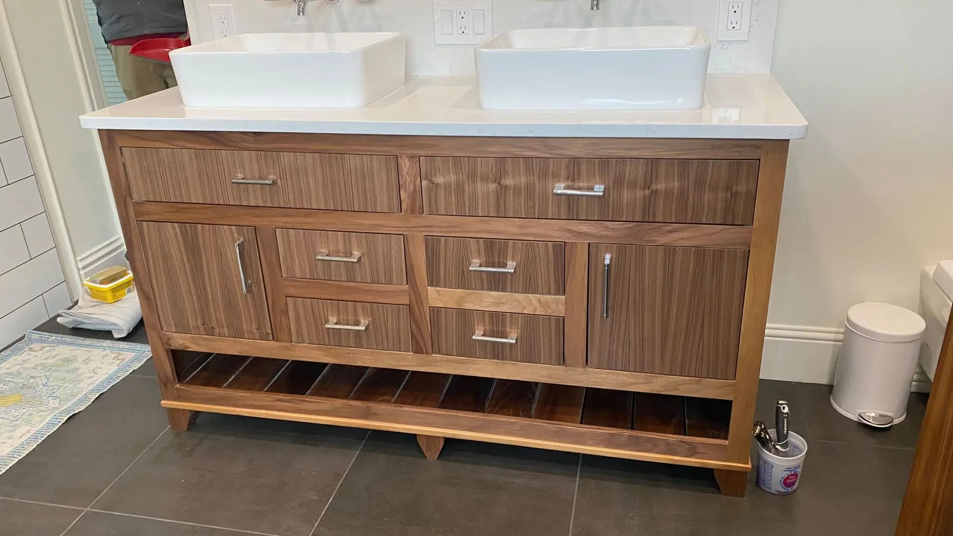 a bathroom vanity with two sinks