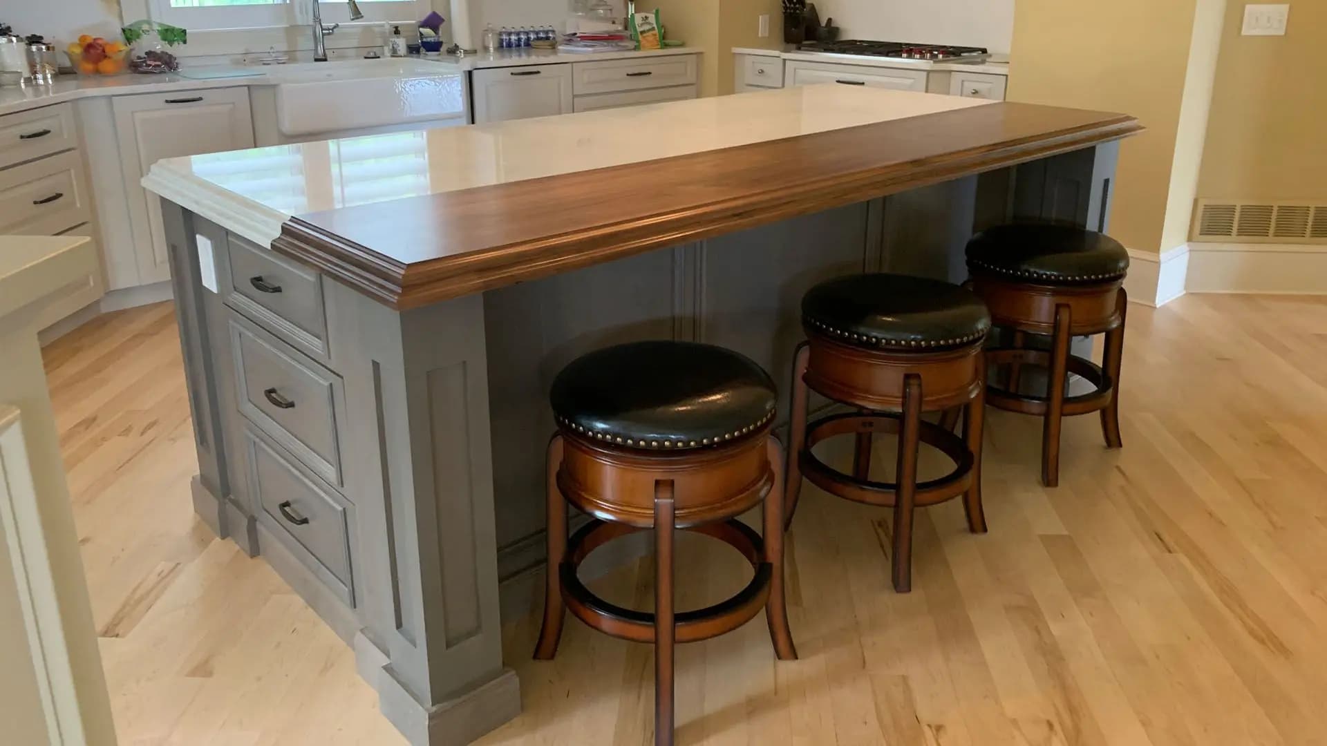 a kitchen with a bar and stools