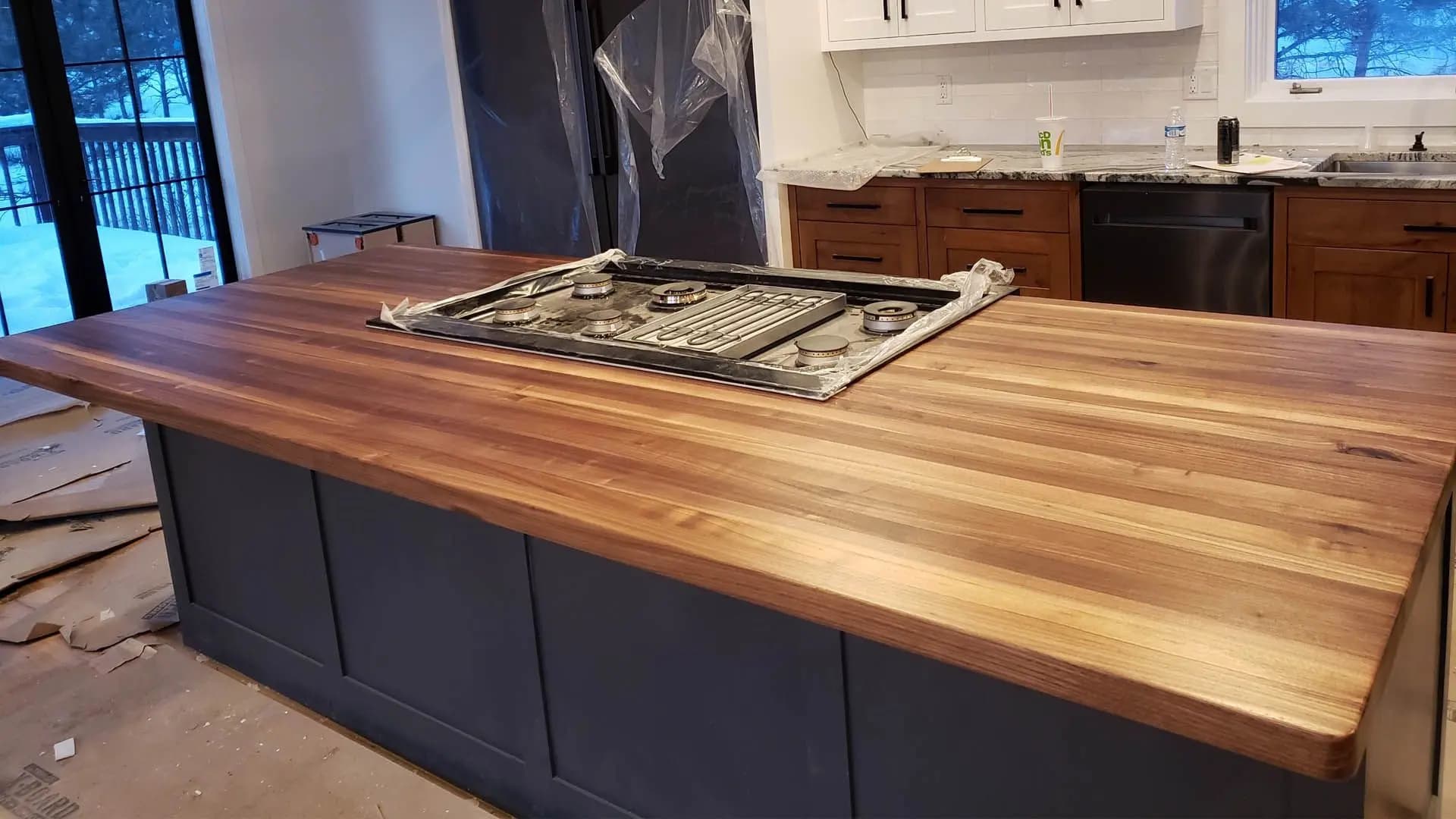 a counter top with a stove top